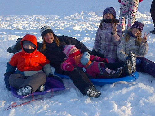 Cousins sledding by ngoldapple