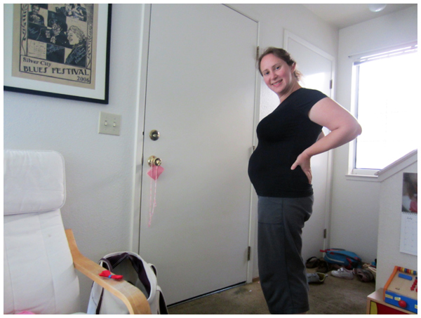 8 weeks pregnant (photo taken by our four year old daughter)