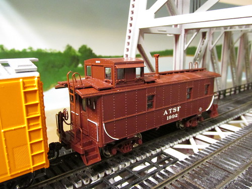 An Athearn model of an Atchison, Topeka & Santa Fe Railroad steel cupola caboose wearing the original pre 1966 color scheme, prior to systemwide caboose rebuilding at the Cleburne Texas Railroad Shops. by Eddie from Chicago