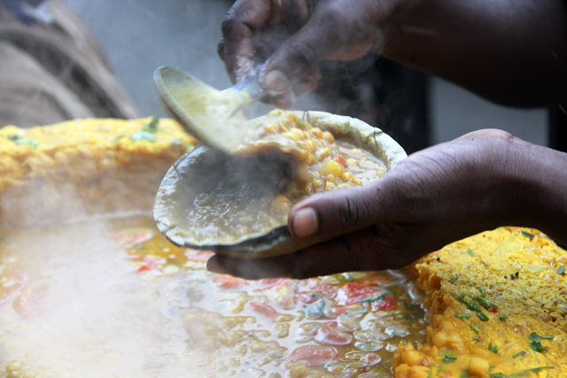 Mixing up a fresh bowl of ghugni chaat in Kolkata, India