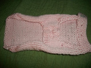 Underbelly of the pink dog sweater.