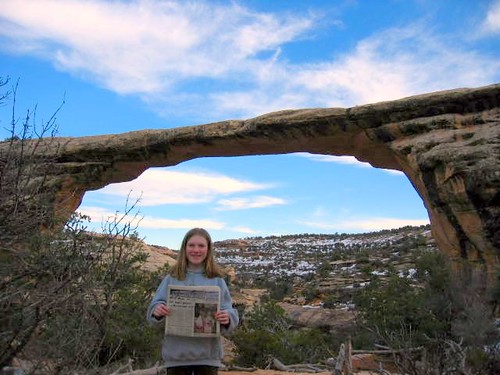 Reading the Local Newspaper in Front of an Arch, Utah