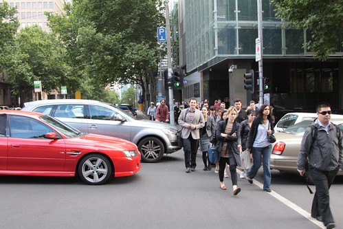 Cars block pedestrians at the corner of William and Lonsdale Streets