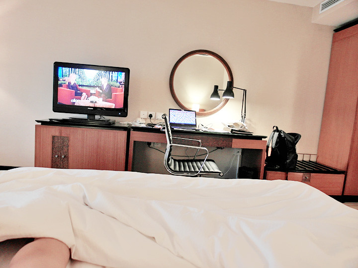 grand mercure roxy hotel on bed watching tv
