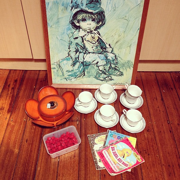 Today's market finds: sad smoking child print, seventies serving set, nice old tea set, some Golden Books and raspberries.