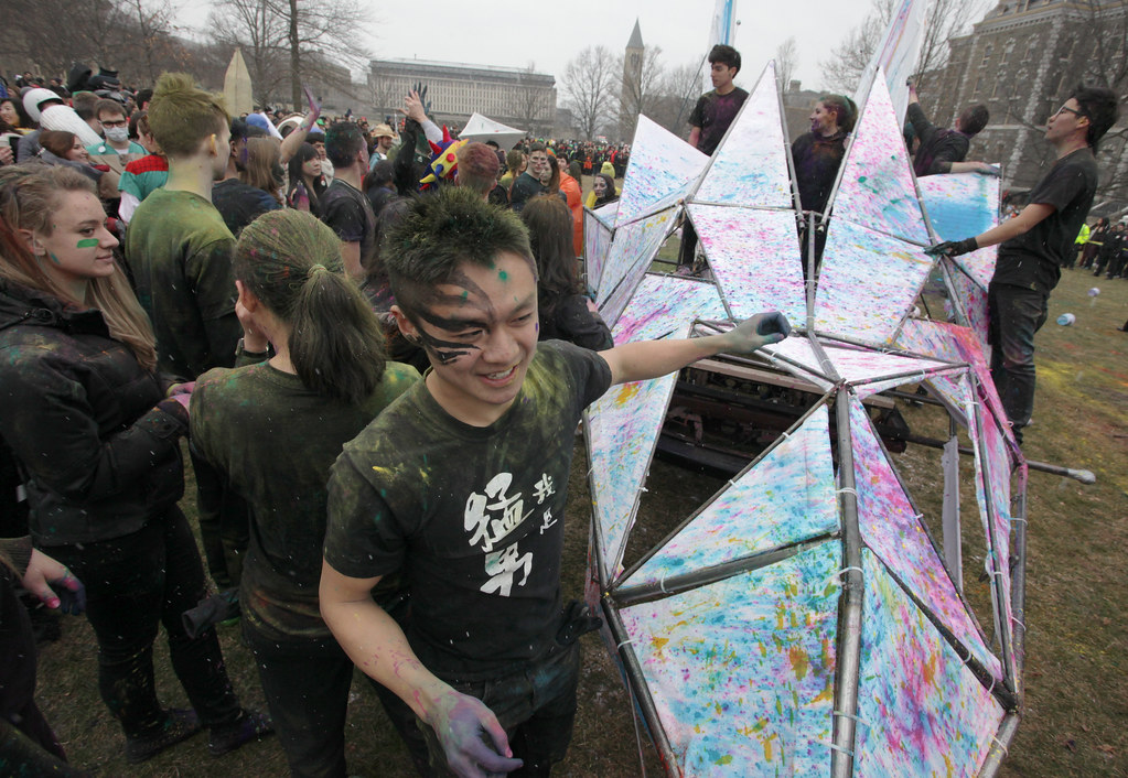 First-year students celebrate their successful march around campus and arrival on the Arts Quad during Dragon Day 2013.