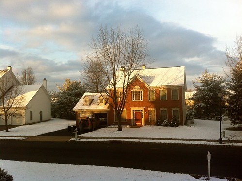 Sunrise on a snowy morning puts a coat of white on all the houses