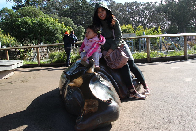Mio and Mama atop a hippo
