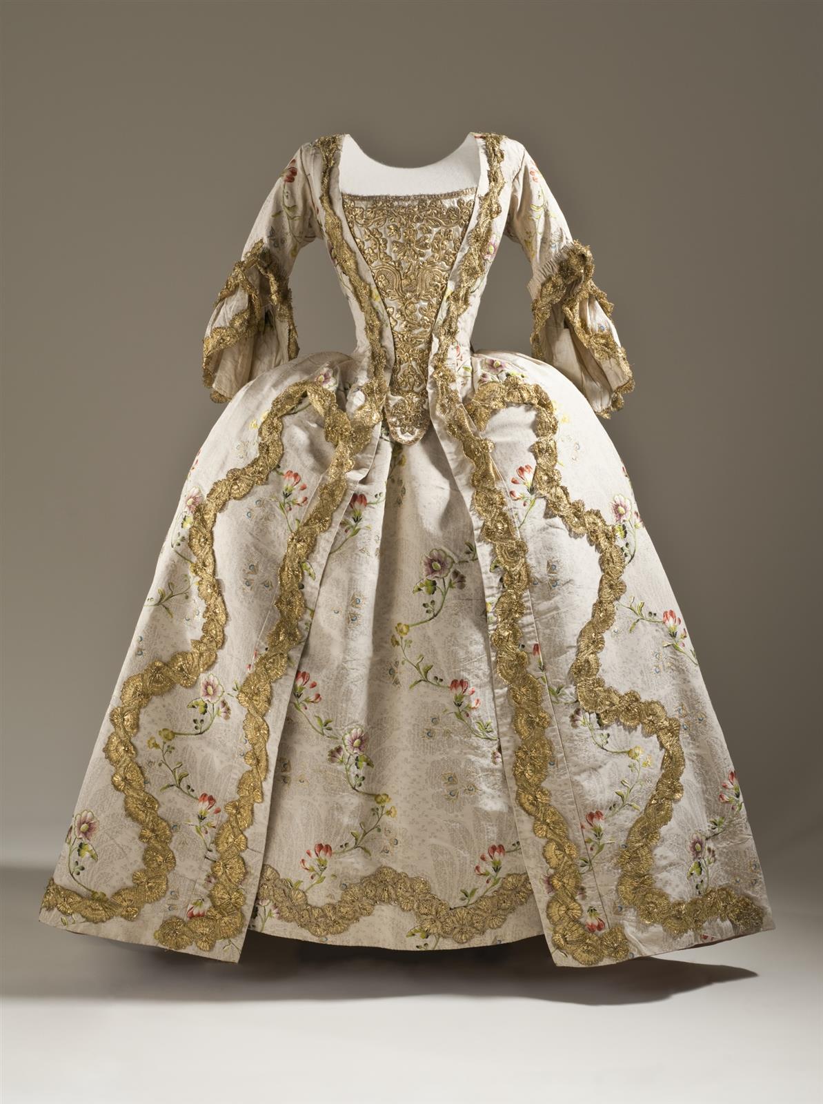 1760. Robe à la française. French. Silk plain weave (faille) with silk and metallic-thread supplementary weft patterning, and metallic lace trim. LACMA