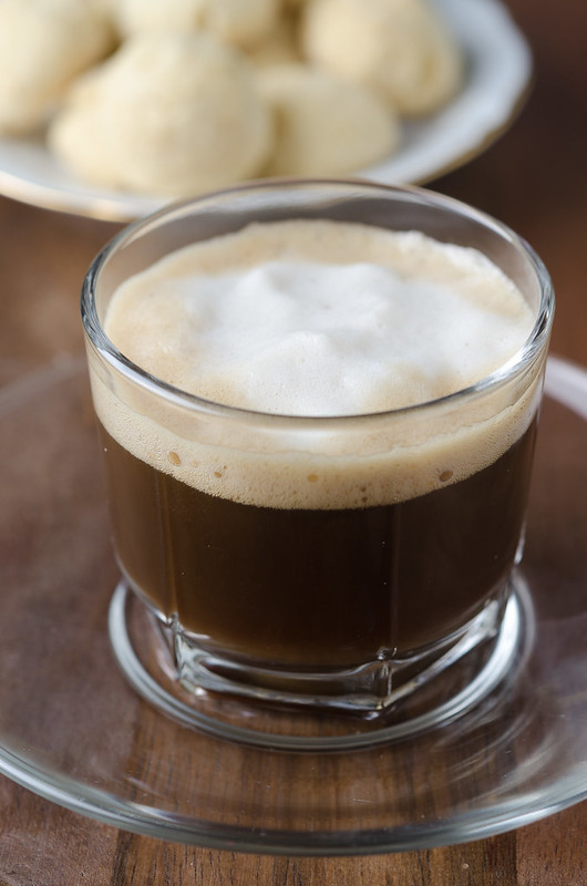 Доброе утро! Glass cup of coffee with froth with shortbread, selective focus_1