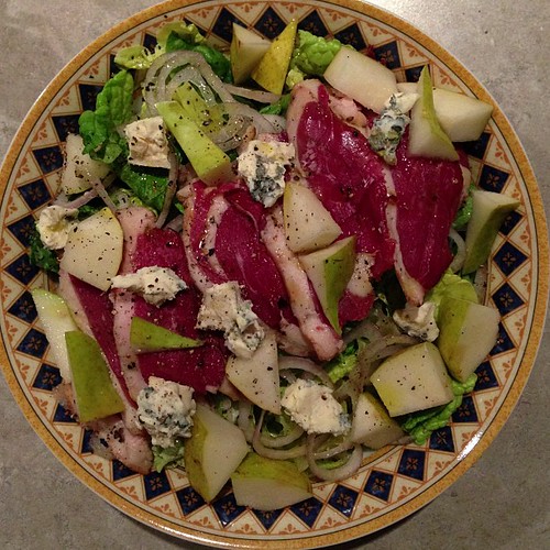 Salad with smoked duck breast, shallots, Bleu d'Auvergne, and pears.