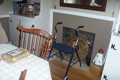 My walker that I had to buy after I fell down the side deck stairs and hurt my body so I could barely walk. It doesn't have a home in our home except here in the dining room.
