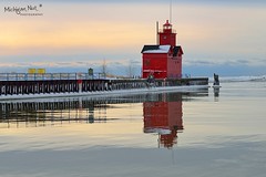 "Reflected Light" Holland Harbor Lighthouse, known as (Big Red). by Michigan Nut
