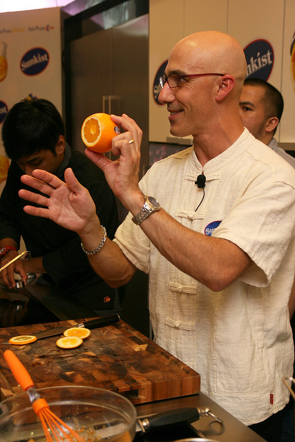 Chef Robert Danhi showing the cut bottom of a navel orange