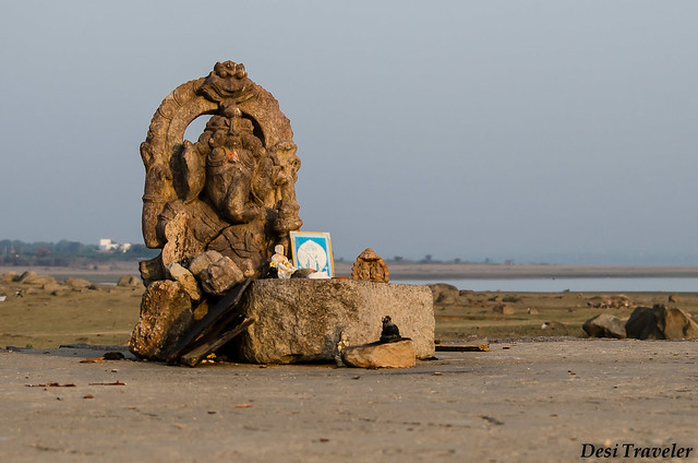 a ganesha idol on the bank of lake gandipet