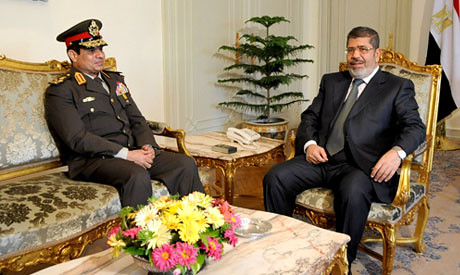 Egyptian Minister of Defense Lt. Gen. Abdel-Fattah el-Sissi with President Mohamed Morsi. There is a delicate relationship between the FJP and the military. by Pan-African News Wire File Photos