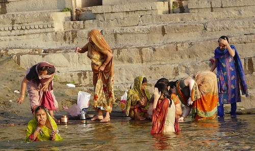 Women bathing in the Ganges in Varanasi passing through (Varanasi, India)