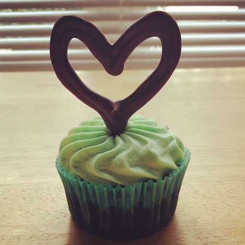"Minted Love Cupcakes" = chocolate cupcakes + mint chocolate ganache filling + vanilla mint cream cheese frosting + handmade chocolate heart topper.