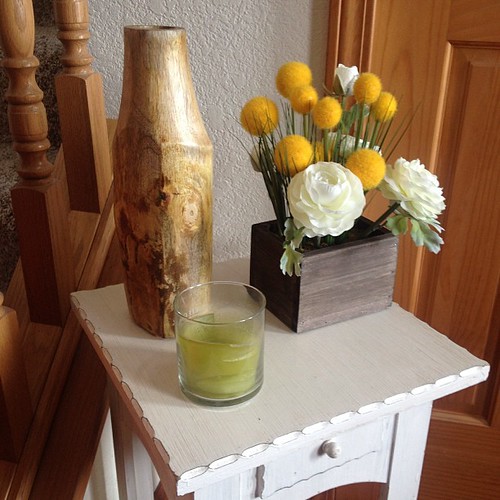 I spruced up the little table in my foyer with this wooden vase and fake floral arrangement.  #target
