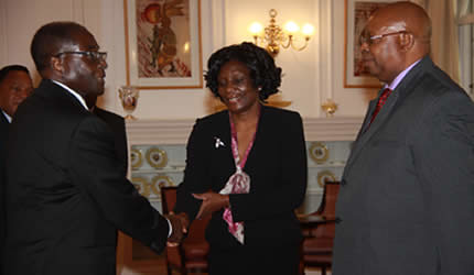 President Mugabe congratulates new ZEC chairperson Justice Rita Makarau and Human Rights Commission chairperson Mr Jacob Mudenda after swearing them into office at State House in Harare on March 15, 2013. by Pan-African News Wire File Photos