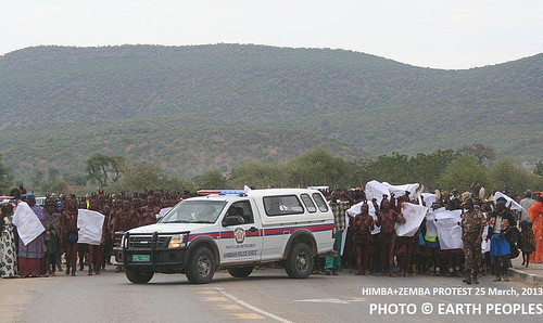 Police car blocking the protest march of Himba and Zemba in Namibia, but the protesters continue their peaceful walk towards Opuwo, where they will meet the governor of Kunene