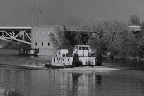A river towboat heads west on the Chicago Sanitary and Ship Canal.  Summit / Lyons Illinois.  May 1989. by Eddie from Chicago