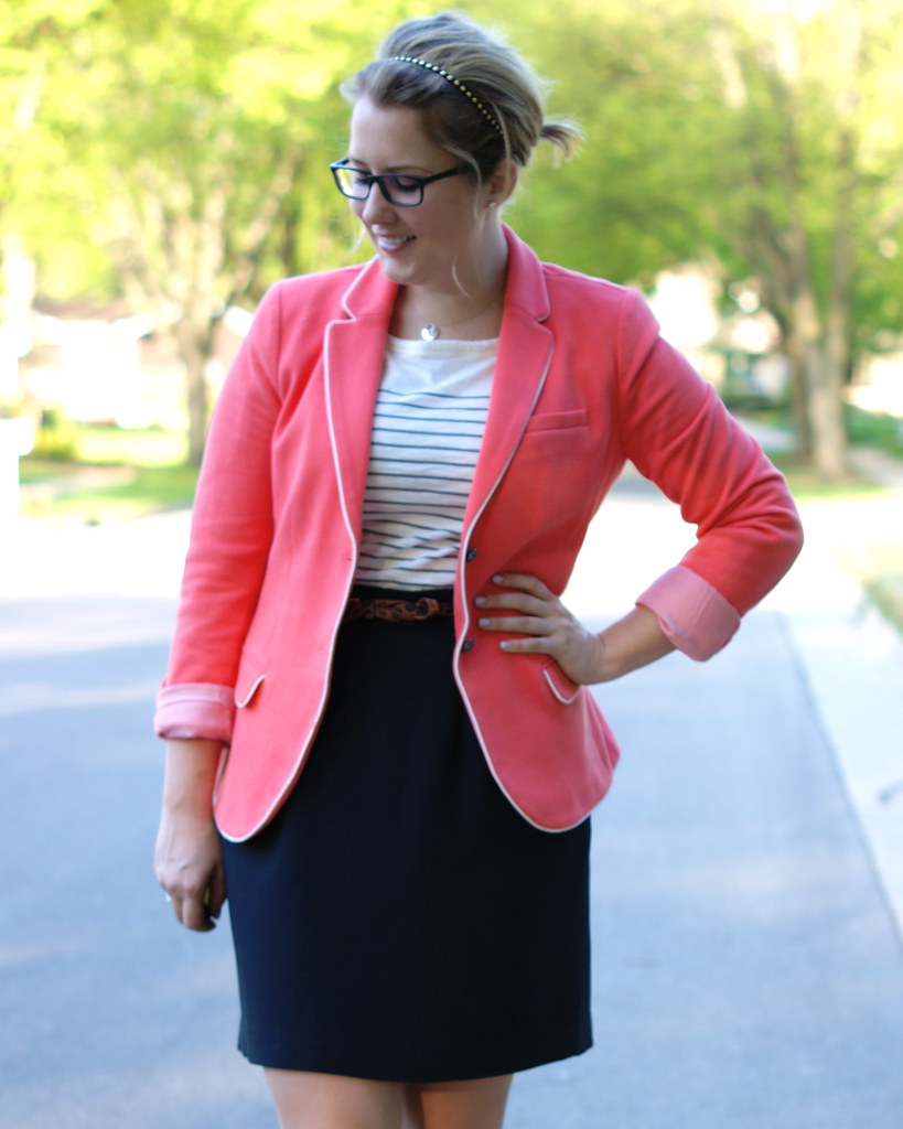 coral blazer with a black skirt