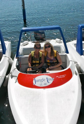My friend and I in our speedboat at the end of the trip. We survived!