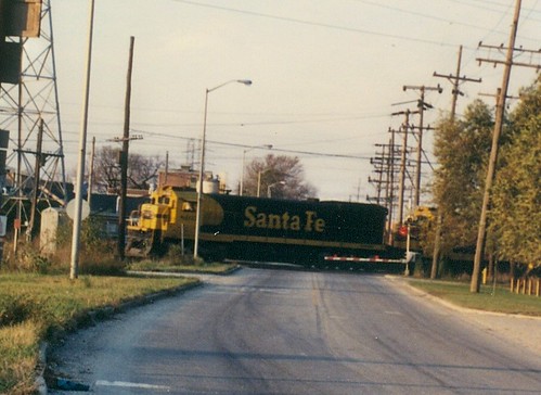 A westbound Atchison, Topeka & Santa Fe freight train crossing South Lawndale Avenue.  Mc Cook Illinois.  November 1989. by Eddie from Chicago