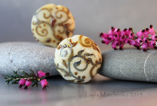 A pair of ivory beads