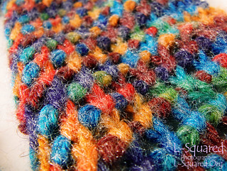 Another close-up of the stitching to show off the colorful fuzzy yarn 