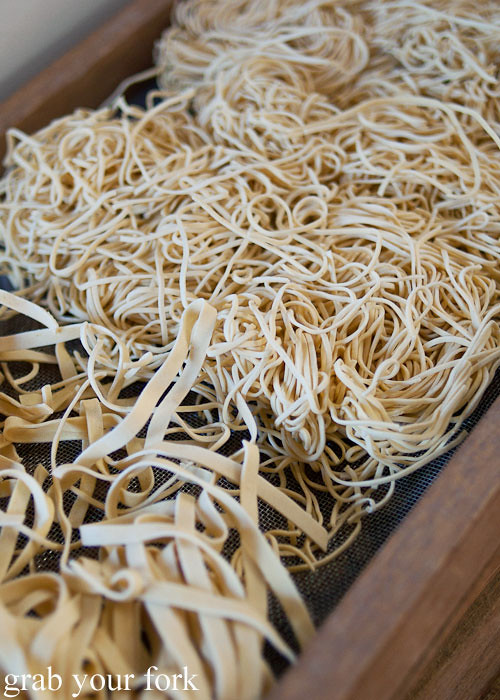 fresh pasta drying on racks at pasta emilia surry hills