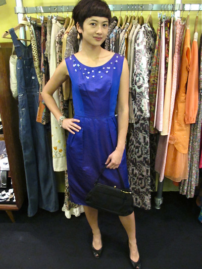 Royal blue 1950 shift dress with sequins sewn into the decolletage. Size: XS/S. Worn with a 1950s black purse and 1980s peep-toe heels. 