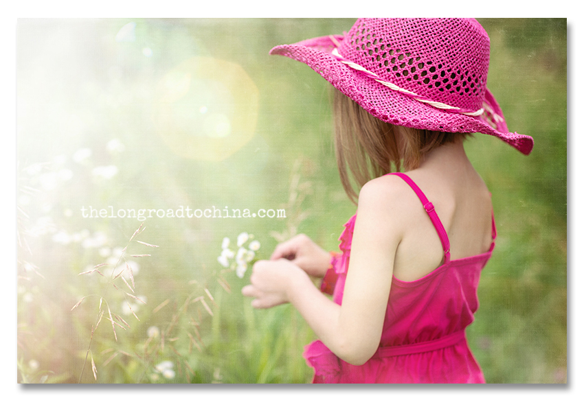 Sarah picking flowers in pink cowgirl hat2 BLOG