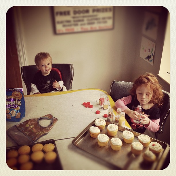 Frosting cupcakes.  #kids #cooking