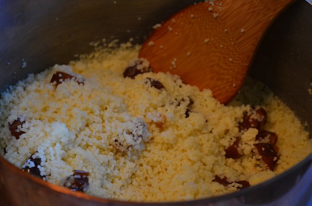 couscous with dates and butter in pot