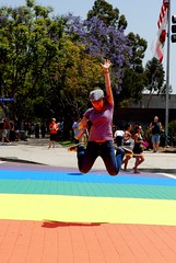 Kim jumping over a rainbow