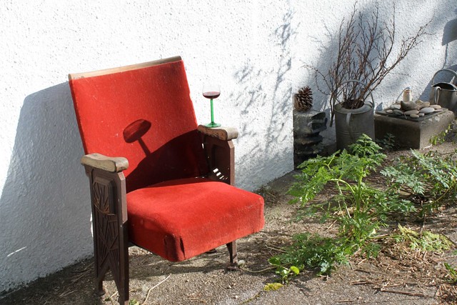 Old cinema chair set up for evening sun.