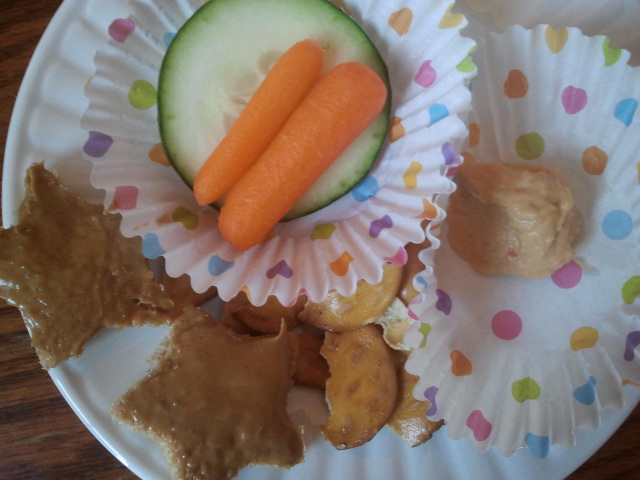 Addy eats: star shaped toast with peanut butter, pretzel thins, carrots and cucumber with hummus