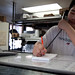 Takeout worker taking order at Peking House, Dudley Square, Roxbury posted by Planet Takeout to Flickr