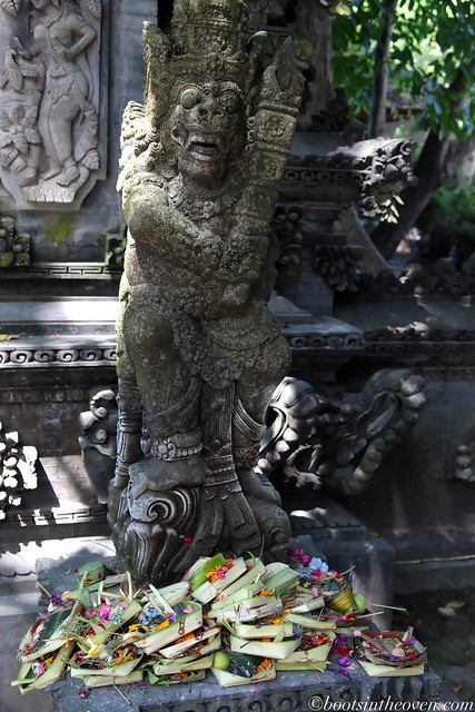 Offerings piled at base of statue
