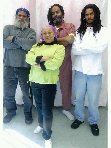 MOVE members Abdul, Pam and Mike Africa with Mumia Abu-Jamal. Mumia is now in general population after being taken off of death row. A demonstration in Washington on April 24, 2012 demanded his freedom. by Pan-African News Wire File Photos