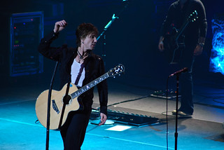 Lead singer of the Goo Goo Dolls, Johnny Rzeznik, plays acoustic guitar onstage during a live performance in Peoria, Illinois
