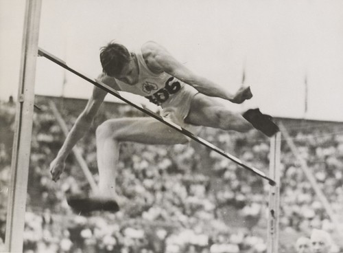Athlete John Winter winning the high jump event at the London Olympic Games, August 1948.