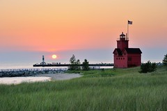"Big Red"  Holland Harbor Lighthouse Sunset by Michigan Nut