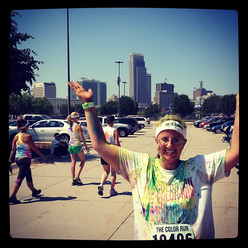 JPAD:14: Building. Here I am after the color run with the Omaha skyline behind me.