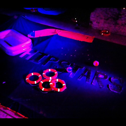 You know it's a scenester party when the pool is covered in giant Helvetica and bathed in neon. #youknowyoureahipster