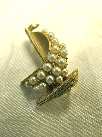 Sail the seven seas with this lovely pearly sailboat brooch!
