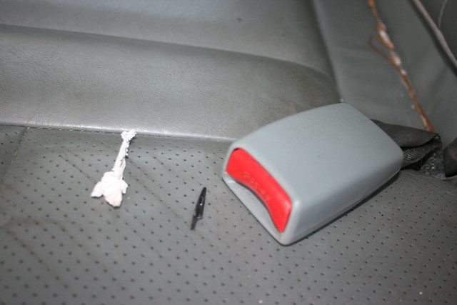 Teach your children not to put stuff in the seatbelt latch!