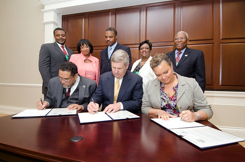 Left to right Tuskegee University President and Council of 1890 Universities Chair Gilbert Rochon, Agriculture Secretary Tom Vilsack and Administrator of the Environmental Protection Agency (EPA) Lisa Jackson sign the 2012 Memorandum of Understanding among the department, agency and council on Friday, June 29, 2012, in Washington, DC. It has been150 years since the first Morrill Act of 1862, which was signed by President Abraham Lincoln. The action established land-grant universities in every state and territory. The second Morrill Act of 1890 provided funding to designate separate institutions of higher learning for blacks in those states that did not open the doors of their universities to black students.   USDA photo by Lance Cheung.